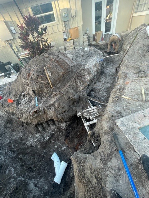 Excavated trench with underground pipework