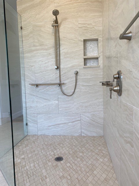 Shower tile, handheld fixture, and recessed niche